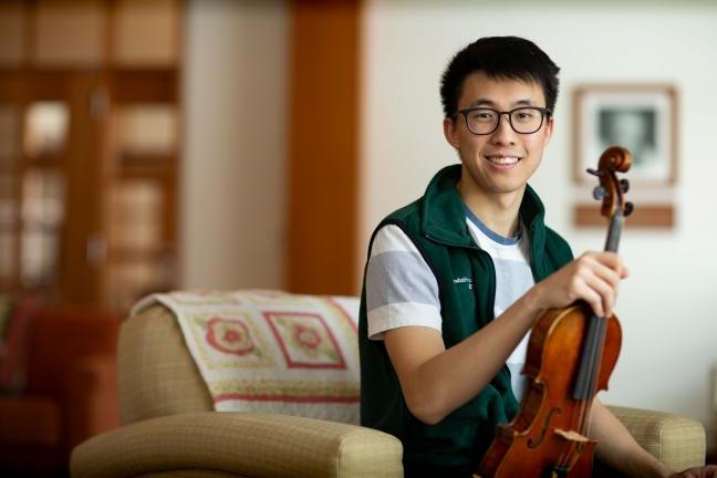 D-H volunteer Bryan Shin with his violin